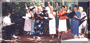 The Turners Singers with Director Linda Kaan at their Garden Concert in June 2002